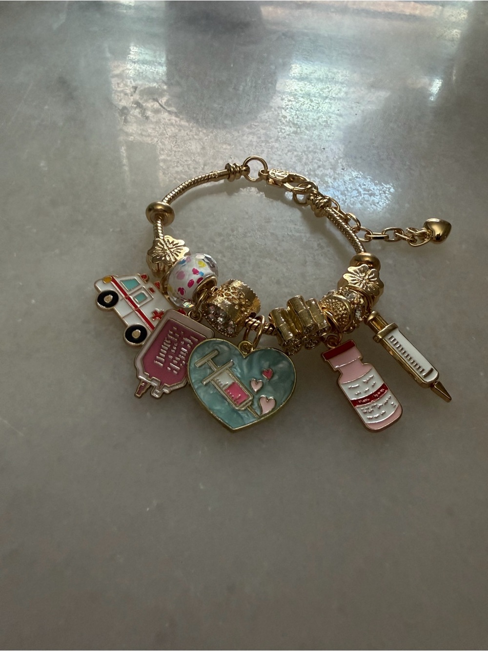Gold-Tone Medical Charm Bracelet with Pink & Teal Accents